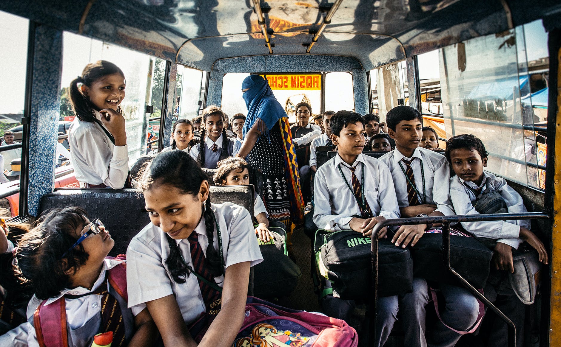 selective focus photography of child on bus