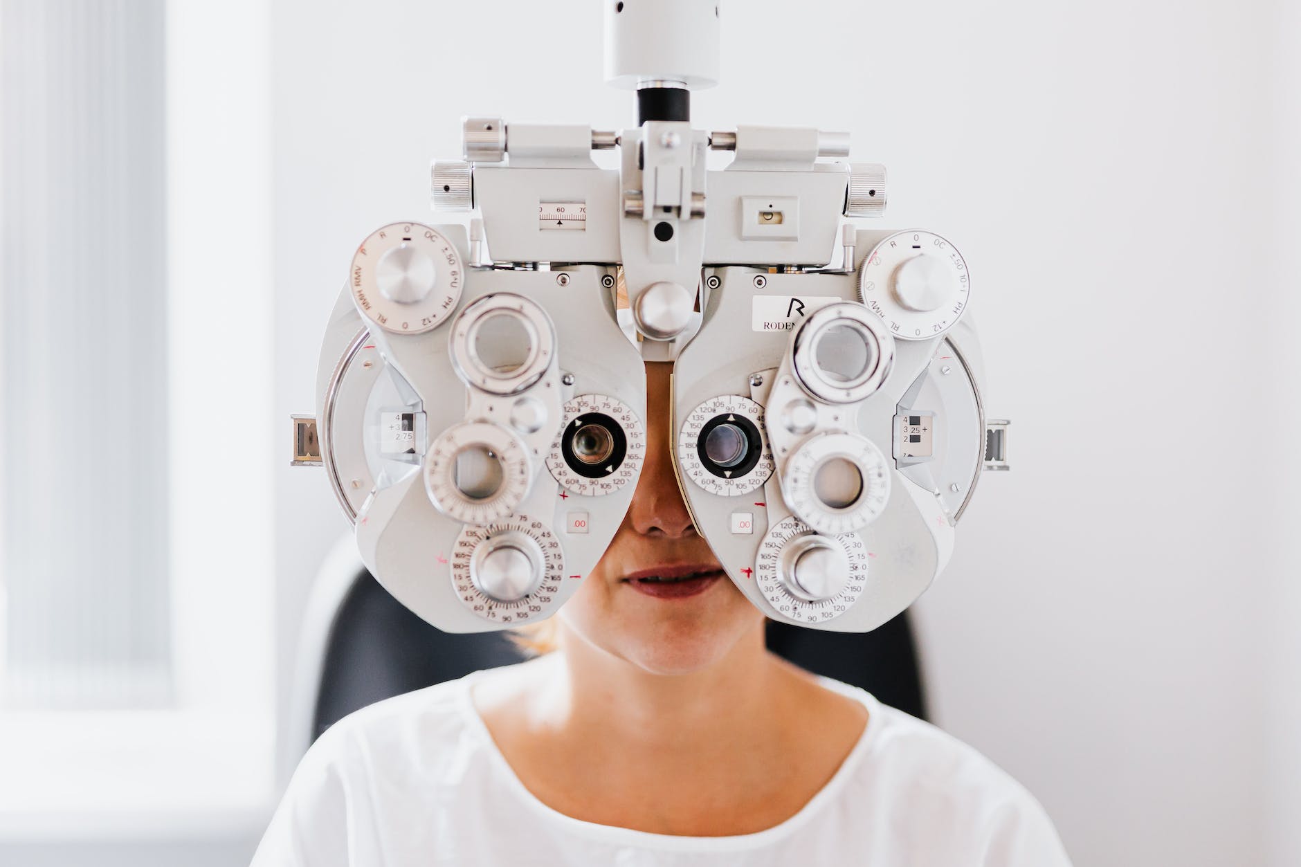 a person in white shirt having an eye examination