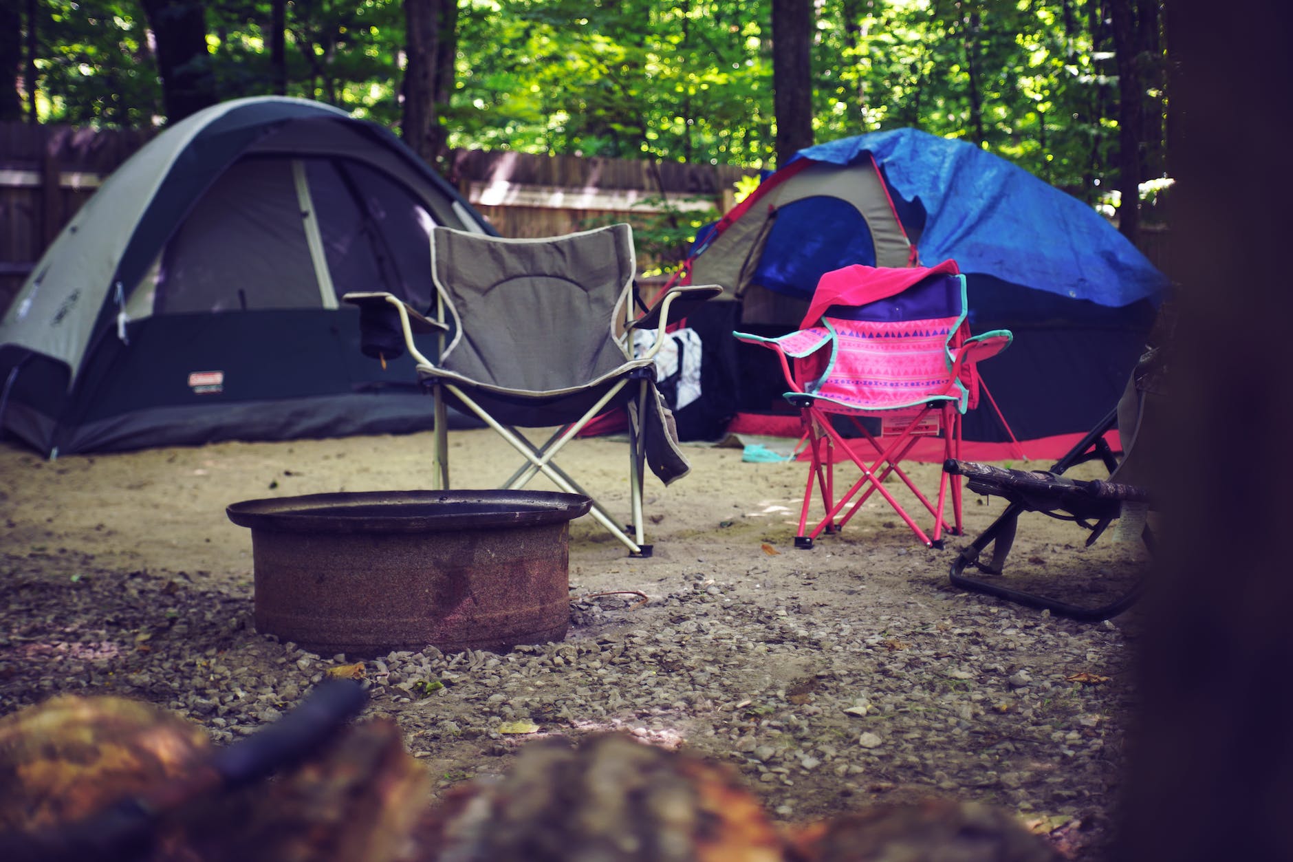 two pink and gray camping chairs